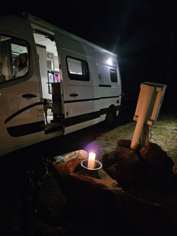 A candle between the vans I had brought this church candle for the practical purpose of drying kindling if we ever needed it. That day I learned a friend had died by suicide. I lit the candle for him between the vans, and it stayed alight all night. A candle between the vans I had brought this church candle for the practical purpose of drying kindling if we ever needed it. That day I learned a friend had died by suicide. I lit the candle for him between the vans, and it stayed alight all night.