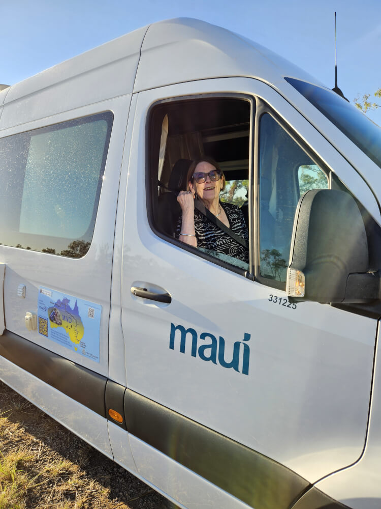 Jenny on the road Jenny smiling from the driver's window of the support van