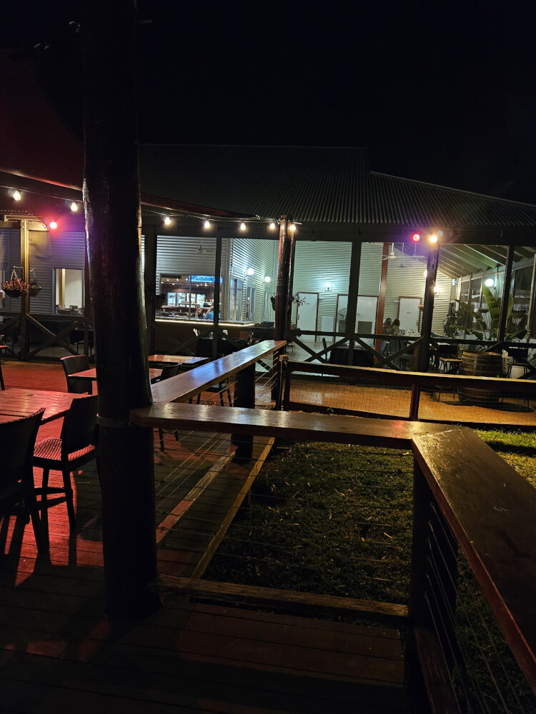 Fitzroy River Lodge outdoor area Outdoor dining area at Fitzroy River Lodge illuminated at night