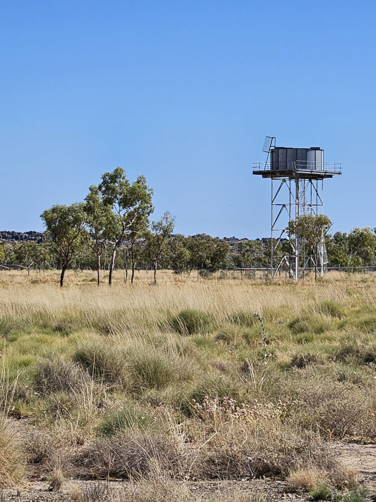 Outback Windmill Windmill standing among dry grass and trees near Mimbi Caves