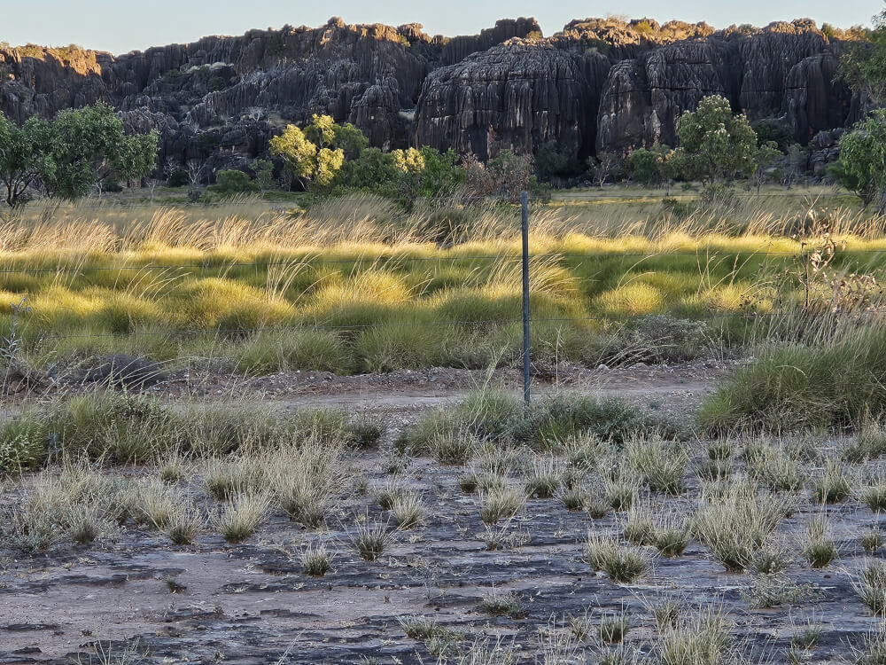 Sunset at Mimbi Evening sunlight on rocky ranges beside Mimbi Caves campground