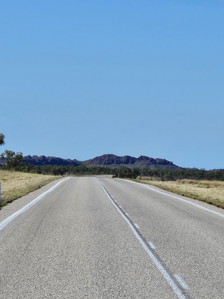 Another Landscape Change Great Northern Highway approaching a dark rocky ridge