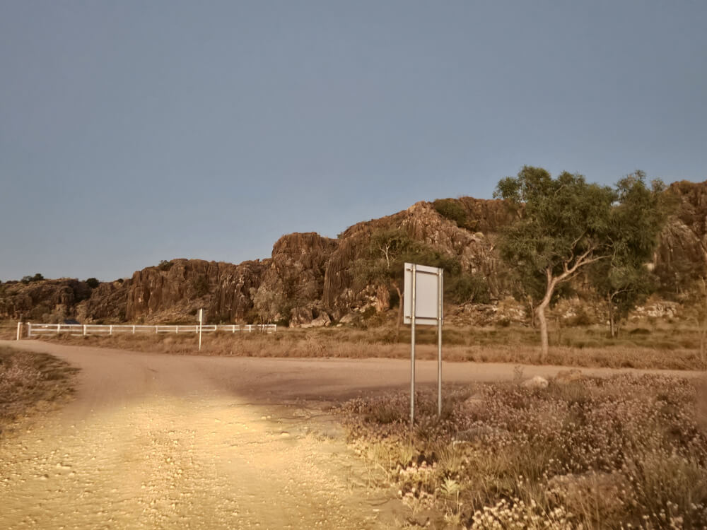 Back to the Highway at 6 am Gravel road approaching the Great Northern Highway near Mimbi Caves at sunrise