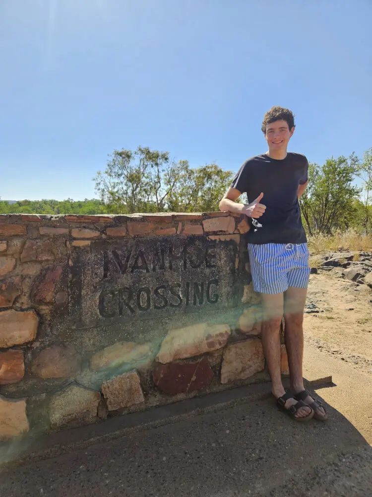 Tom at Ivanhoe Crossing Tom standing beside the Ivanhoe Crossing stone sign