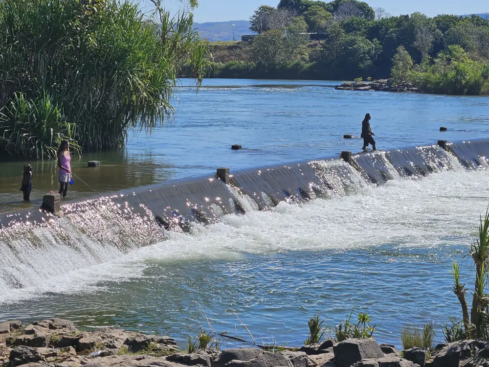 Fishing in Crocodile Country People fishing from Ivanhoe Crossing with water flowing over the crossing