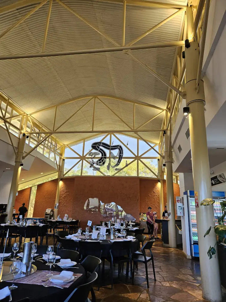 Lunch at the Nitmiluk Visitor Centre Spacious visitor centre dining area with set tables beneath a high vaulted ceiling
