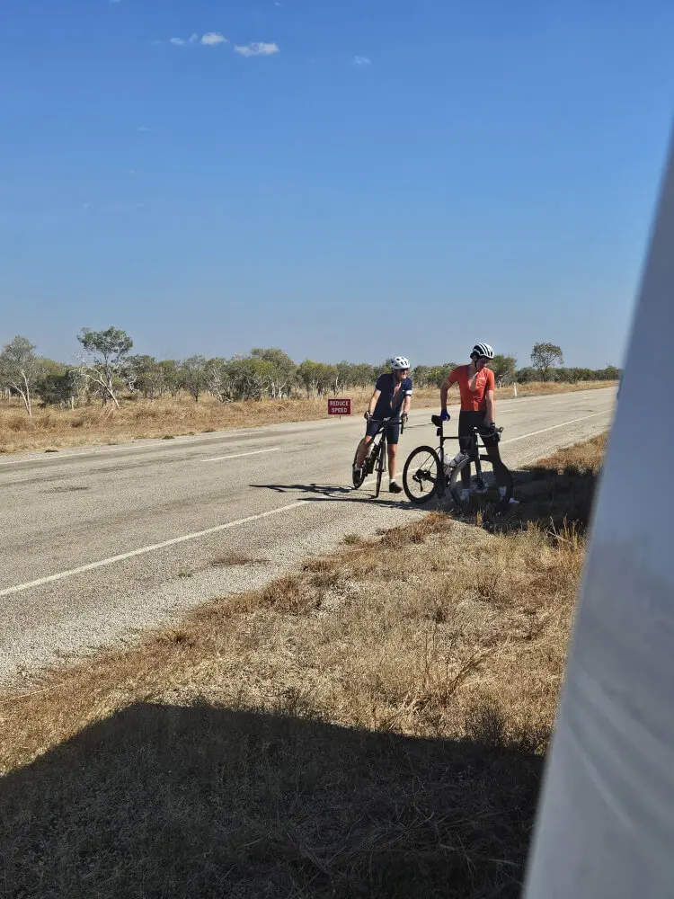 Stopping for ABC Darwin Bob and Tom stopped with their bicycles beside the Victoria Highway