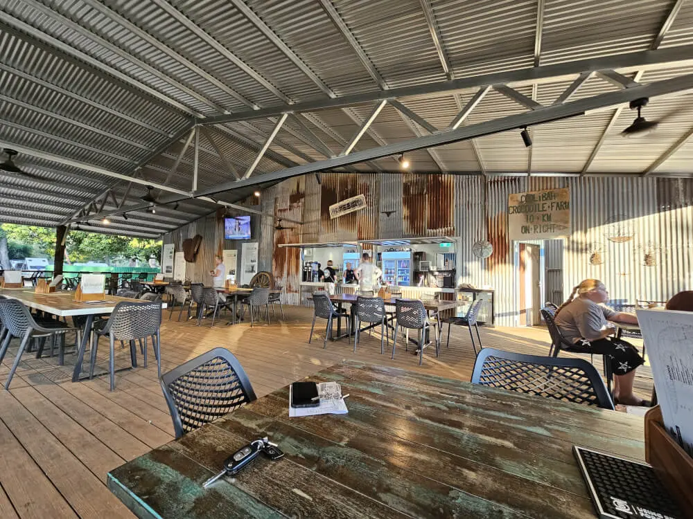 Timber Creek Verandah Large covered verandah with tables and chairs at Timber Creek