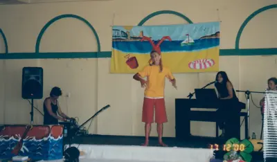 Tara Whitie performing as a sunburnt lobster in the Mega Swim School children's water safety pantomime at Bondi.