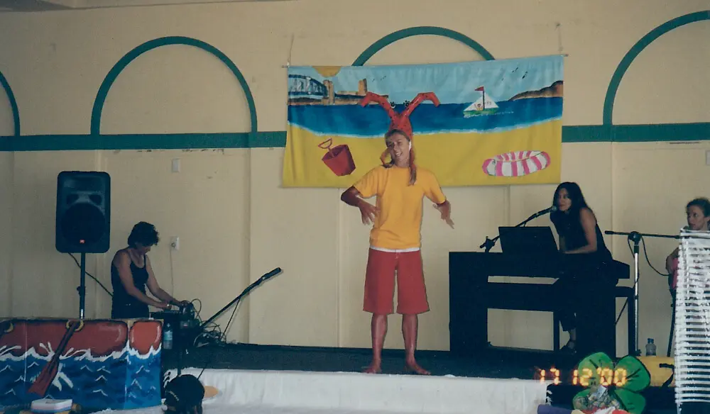 Tara Whitie performing as a sunburnt lobster in the Mega Swim School children's water safety pantomime at Bondi.